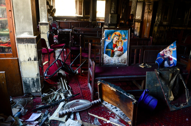 Burned furniture, including wooden tables and chairs, and religious images are seen at the site of a fire inside the Abu Sifin Coptic church that killed at least 40 people and injured some 14 others, in the densely populated neighborhood of Imbaba, Cairo, Egypt, on Aug. 14, 2022.