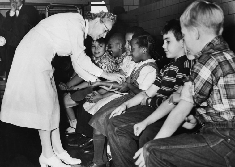 Image: A nurse prepares elementary school students for a polio vaccine shot.