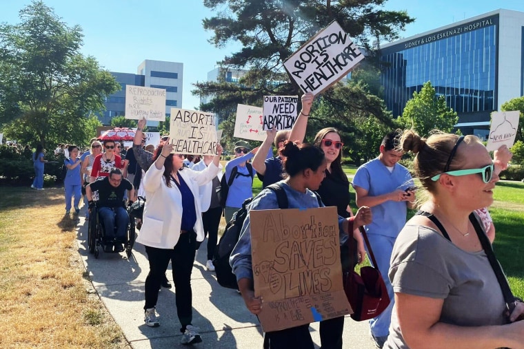 Image: Health care workers and abortion-rights supporters protest following the Supreme Court decision to overturn Roe v. Wade in front of a public hospital in Indianapolis on June 29, 2022.