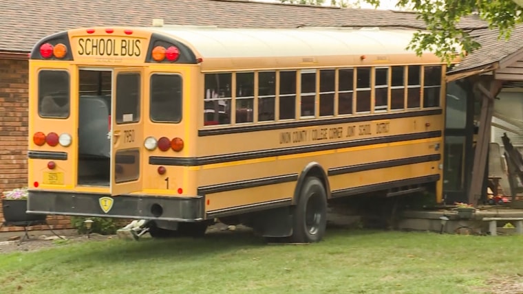 A school bus crashed into a home in College Corner, Ohio, on Aug. 15, 2022.