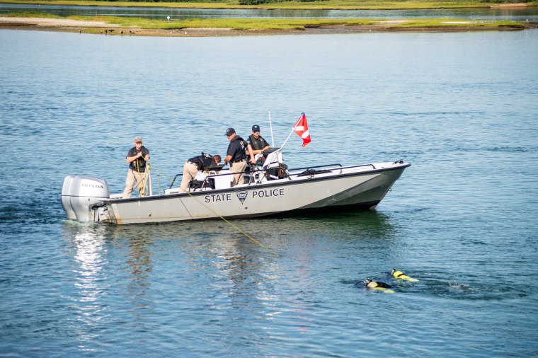 Image: A rescue boat searches the area on Aug. 15, 2022.
