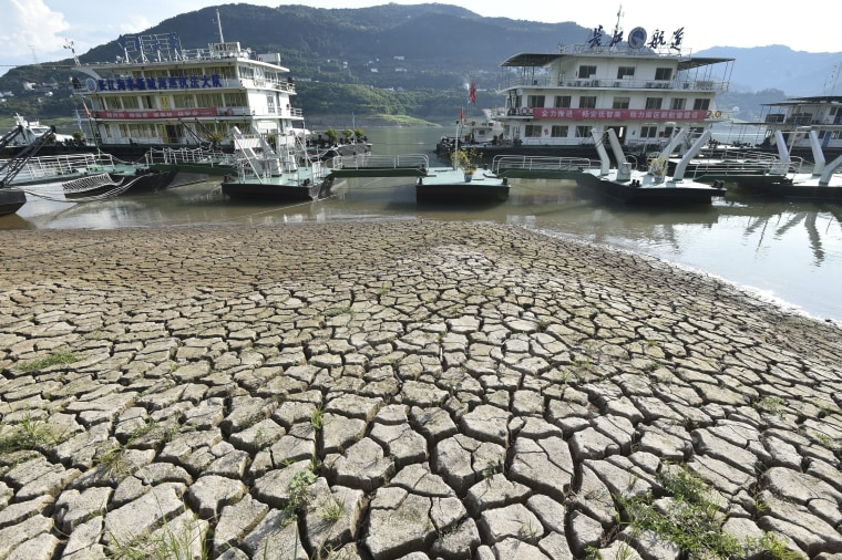 A dried riverbed is exposed on Tuesday after the water level dropped in the Yangtze River in southwest China. 
