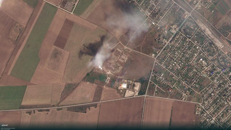 Satellite imagery appears to show smoke possibly caused by ammunition explosions near Dzhankoi on Tuesday.