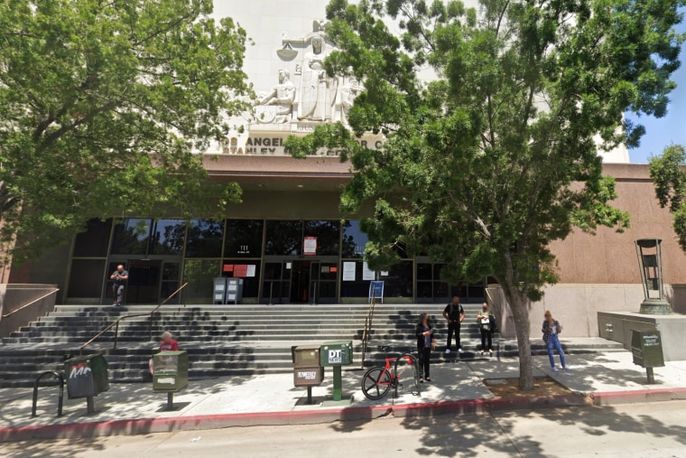 People stand outside the L.A. Superior Court building.