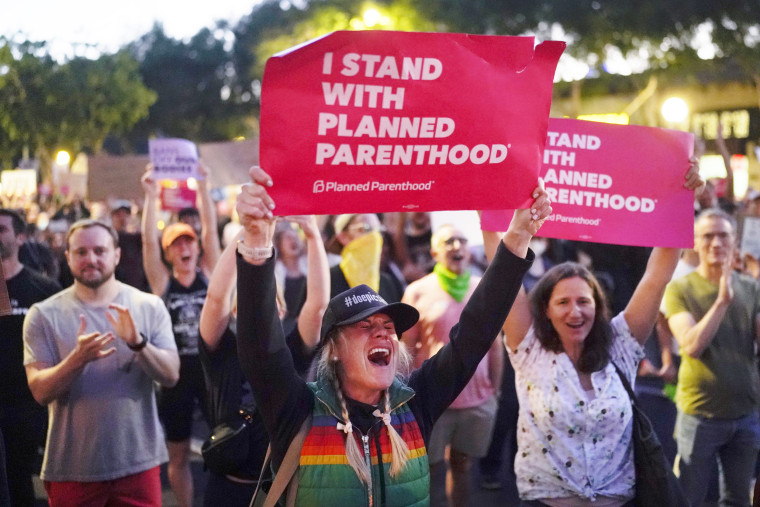 Abortion rights advocates protest outside a Planned Parenthood
