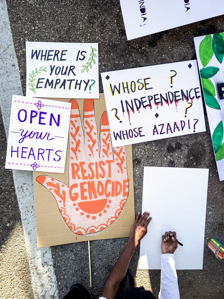 Signs brought by protestors at the Indian Independence Day parade in Anaheim, Cali on Sunday.