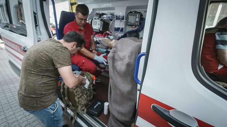 A doctor exercises on a ventilator that was recently donated to help save lives in Ukraine.