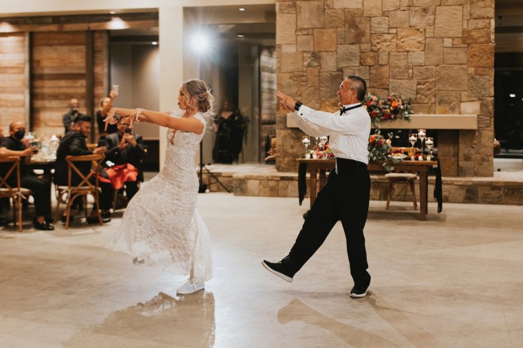 Brittany Revell dances with her father at her wedding. 
