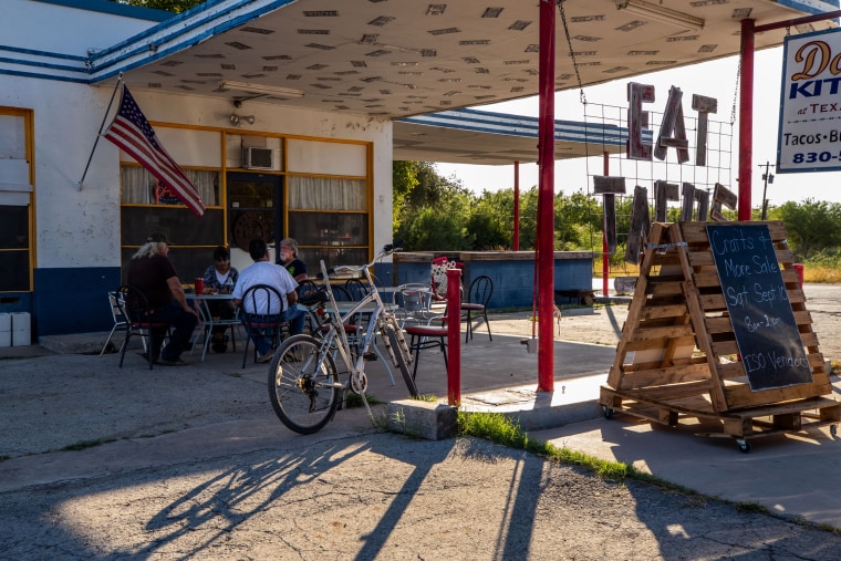 Richard Gonzalez, Sergio Gutierrez and Moises Lozano meet at Darla’s Kitchen for breakfast tacos on most mornings in Brackettville, Texas, on Aug. 10, 2022.