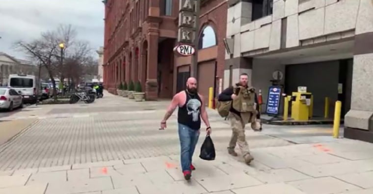 Johsua Pruitt and an associate dressed in tactical gear head downtown to meet up with other members of their Proud Boys chapter at the rally on Jan. 6, 2021.