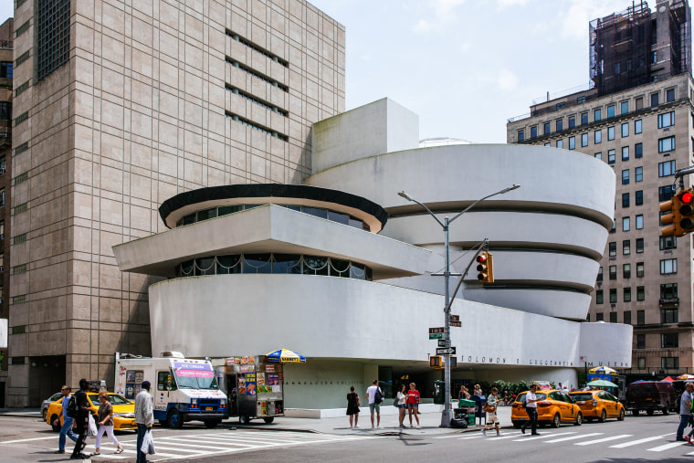 People pass the Solomon R. Guggenheim Museum on July 8, 2019, in New York.