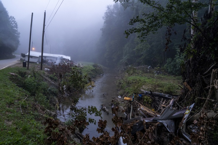 Image: A house sits on the edge of the road after it was swept from its foundation in Lost Creek, Ky., on Aug. 18, 2022.