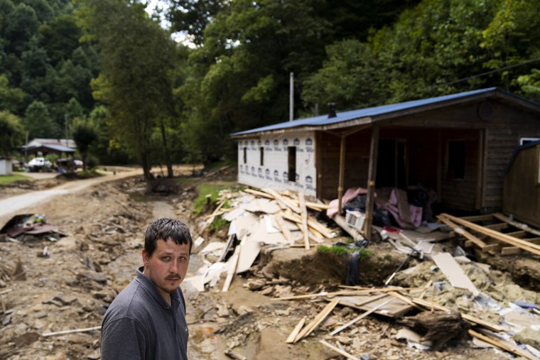 Image: Burley White in front of his flooded house at the River Caney community of Lost Creek on Aug. 18, 2022.