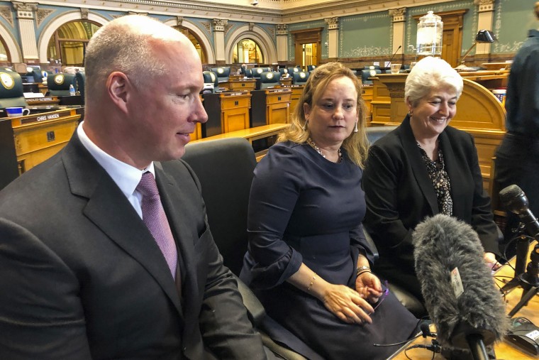Colorado Republican state Sen. Kevin Priola, left, Democratic House Speaker KC Becker, center, and Democratic Sen. Lois Court discuss a proposed ballot initiative to let the state keep excess tax revenue in Denver on March 20, 2019.