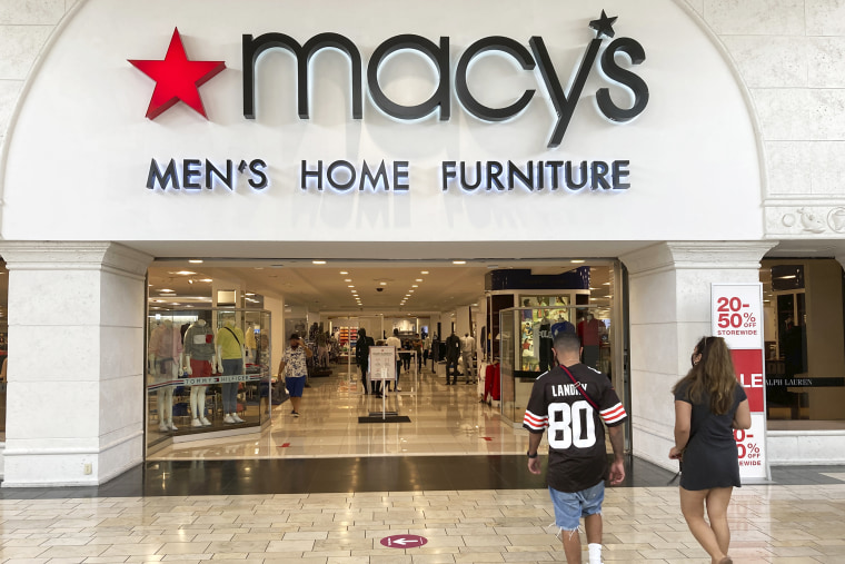 Shoppers walk into a Macy's department store, at Miami International Mall in Doral, Fla., on Feb. 22, 2021.