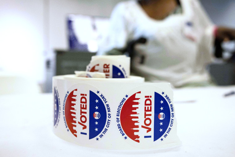 Voting stickers sit on a a table during Primary Election Day