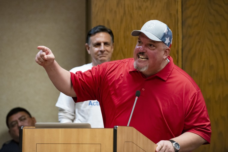 Image: Scott Western during the “Public Comment” portion of a Grapevine-Colleyville Independent School District school board meeting in Grapevine, Texas on Aug. 22, 2022.