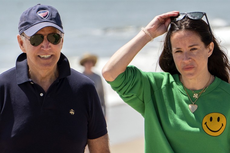 Image: President Joe Biden walks on the beach with daughter Ashley Biden, in Rehoboth Beach, Del., June 20, 2022.