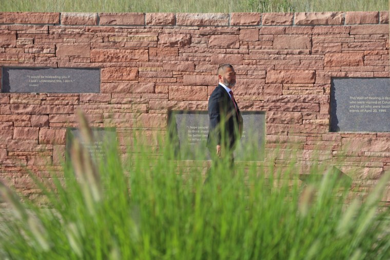 Ronn Nozoe, NASSP CEO, walks through the "Wall of Healing" at the Columbine Memorial.