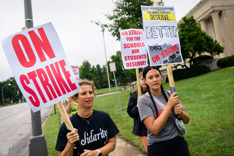 Members of the Columbus Education Association, the labor union representing nearly 4,500 teachers and other school staff in Columbus, Ohio, strike for the first time since 1975