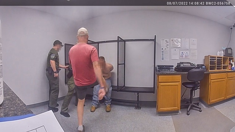 Captain John Grismore kicks a handcuffed man multiple times on Aug. 7, 2022 in Franklin County, Vt.