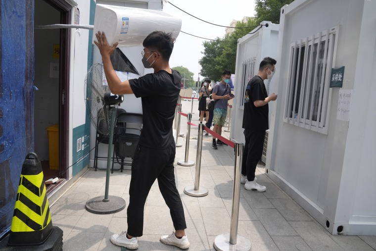 Air-conditioning units are installed as summer heats up at a Covid test site in June in Beijing.