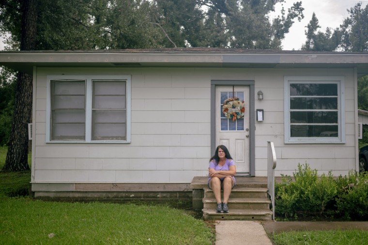 Aimee Autin outside her rented house.