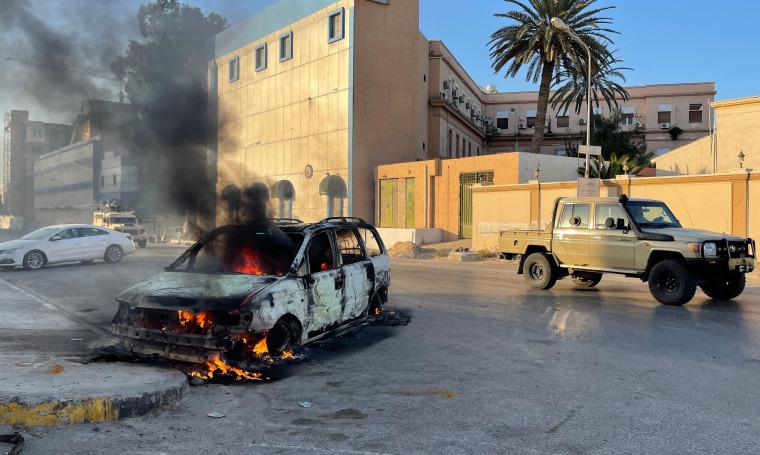 Fighters loyal to the Government of National Unity are pictured in a street in the Libyan capital Tripoli on August 27, 2022, following clashes between rival Libyan groups.