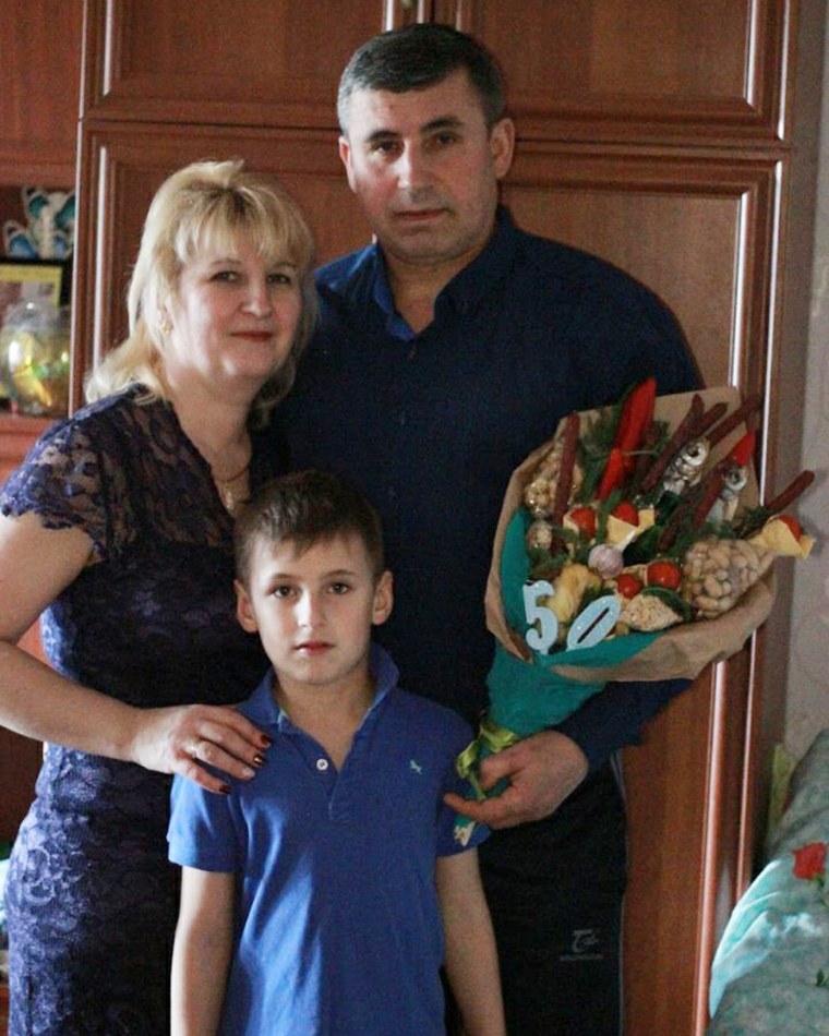 Andriy Bliznyuk with his parents Mikhailo and Oksana. 