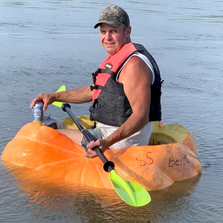 Duane Hansen in “Berta,” an 846 pound pumpkin he paddled down the Missouri River.