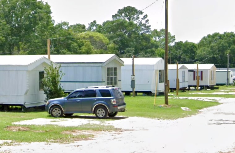 A file image of the mobile home, 2nd-right, that caught fire in Irvington, Al.