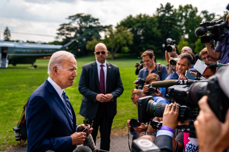 President Joe Biden stops to speak with the press during his walk to Marine One on the South Lawn of the White House on Aug. 26, 2022.