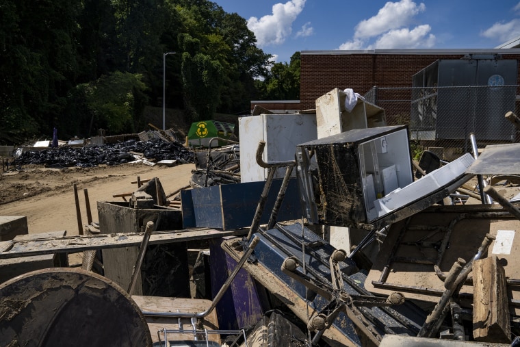 Image: Contents of the classrooms at the Buckhorn School are thrown away due to water damage and contamination in Buckhorn, Ky., on Aug. 19, 2022.