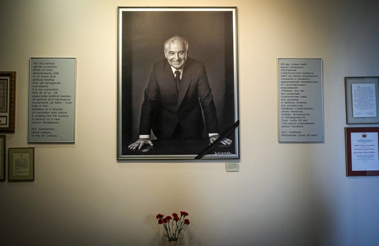 Image: A portrait of the former Soviet President Mikhail Gorbachev and flowers are placed at his foundation's headquarters, a day after his passing, in Moscow on Aug. 31, 2022.