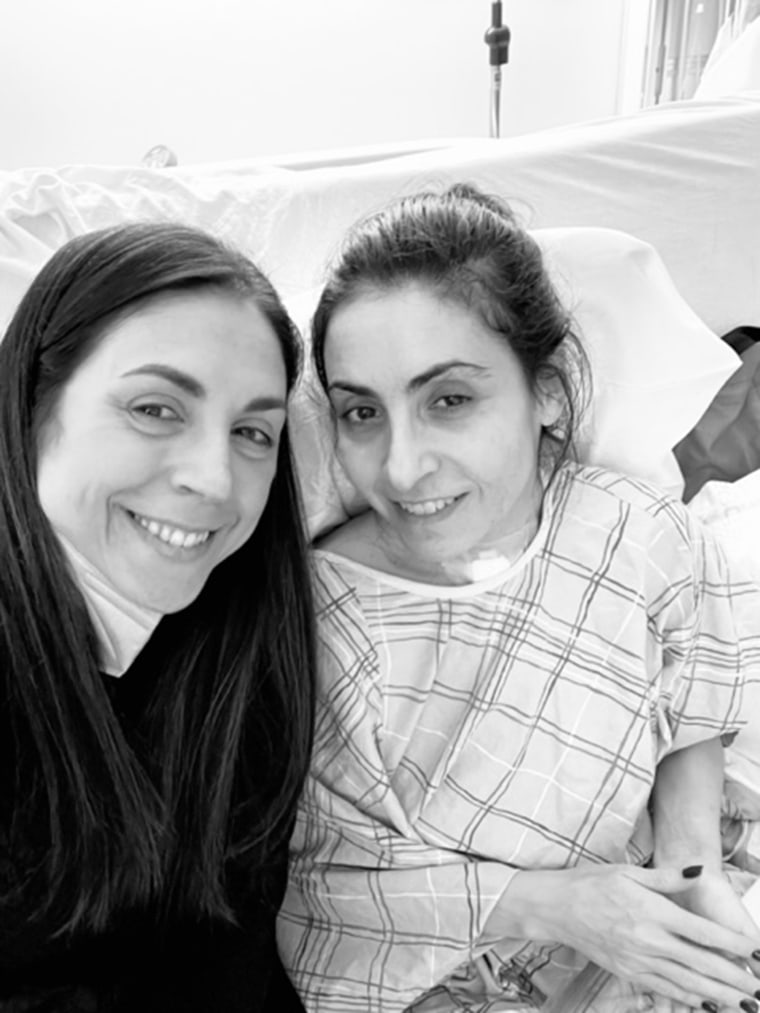 My sister visiting me in the hospital.