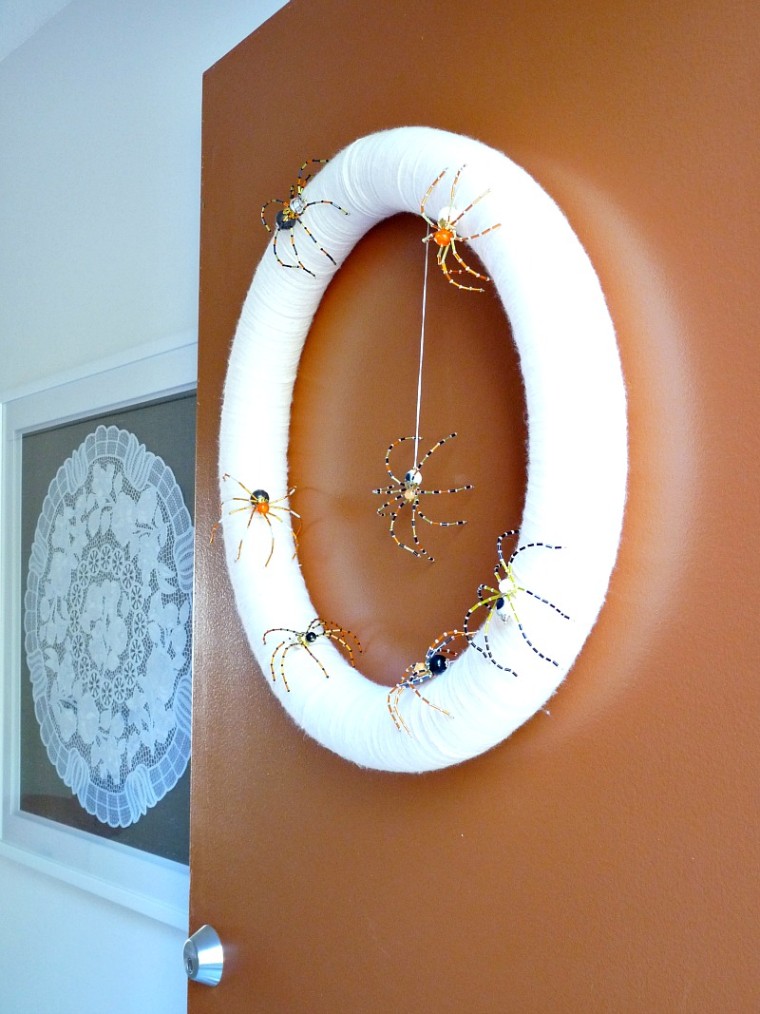 beaded spiders on white wreath