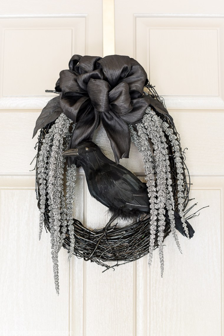 black grapevine wreath with fake crow