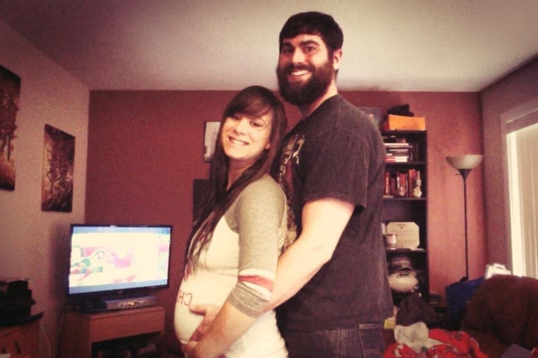 One of the first photos of the author's twin pregnancy and the proud, soon-to-be parents.