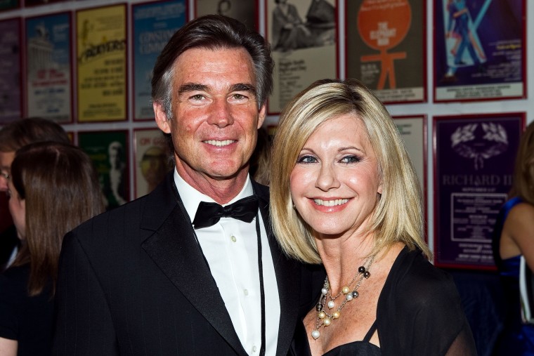 Olivia Newton-John and her husband, John Easterling, attend Honoring The Promise, celebrating the 30th anniversary of the Promise at The John F. Kennedy Center for Performing Arts, on Oct. 16, 2010, in Washington, D.C.