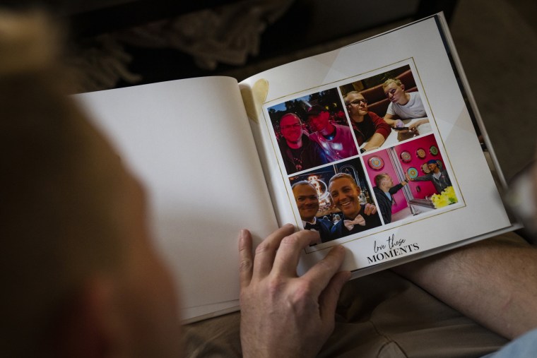 Sean O’Donnell and Ryan Hampton look through past photo albums.