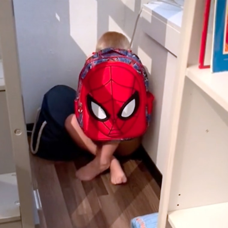 Weston showed his mom how he would use his bulletproof Spiderman backpack to shield his body.
