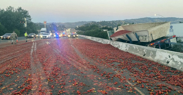 A truck hauling a load of the tomatoes crashed after a collision near Vacaville, Calif., Monday, Aug. 29, 2022.  