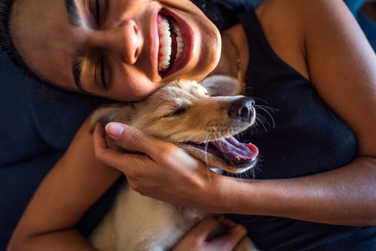 woman and dog smiling