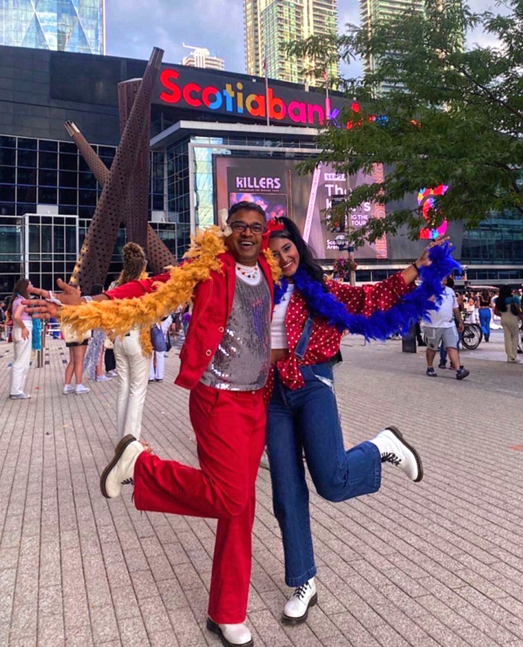 The second night of "Love on Tour" in Toronto, Nari and Sarita Rampersad wore red and royal blue and began attracting the attention of photographers.