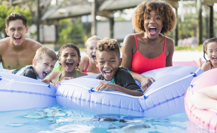 Multi-ethnic children and young adults at water park