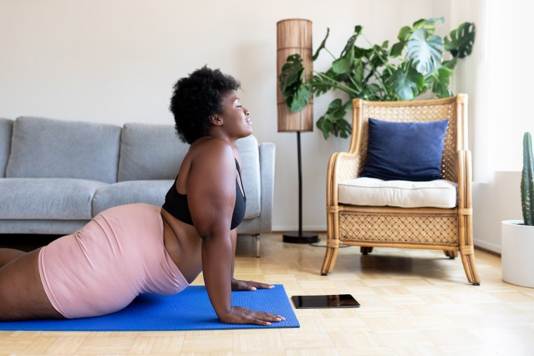 Woman doing yoga exercise at home