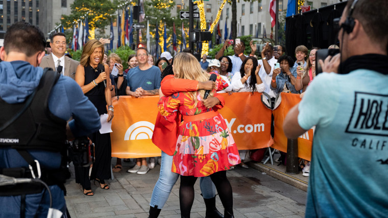 Kelly Clarkson gives Jade, an aspiring performer, a big hug on the TODAY Plaza.