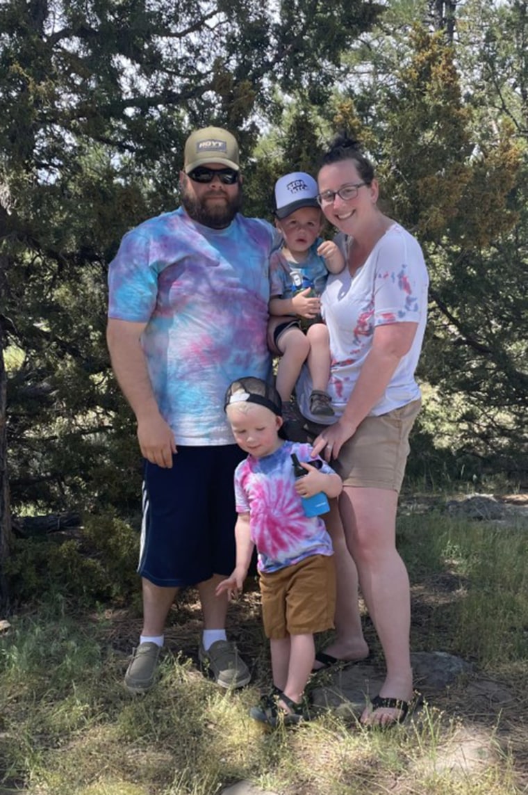 Mom Kala McWain, pictured here with her family, is eager to help her younger son Braxton stay healthy. The only treatment he has for PKU is a special diet.