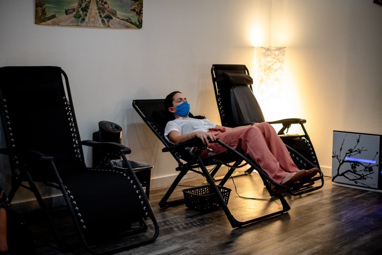 Michelle Garrow gets ear acupuncture therapy in the holistic room of OnPoint NYC in Harlem. Garrow was once a visitor of the center and has worked there for more than a year. 