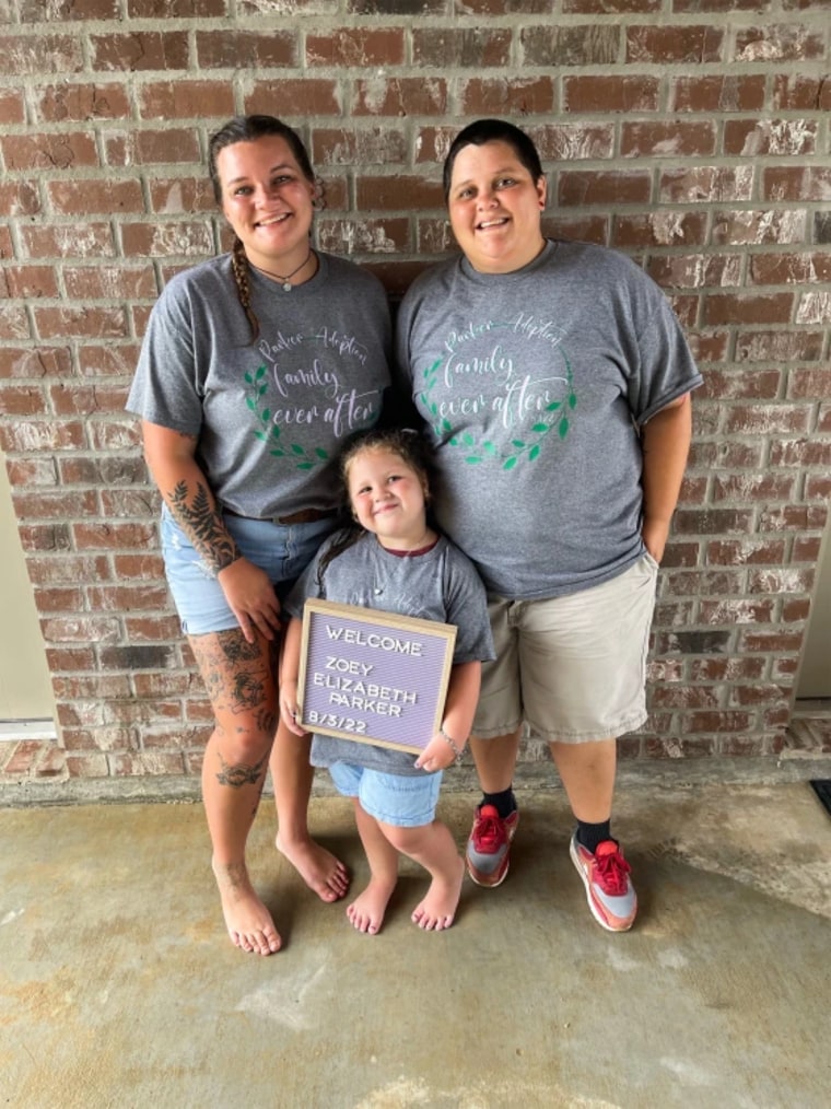 Emily and Jennie Parker, left to right, with their newly adopted daughter, Zoey.